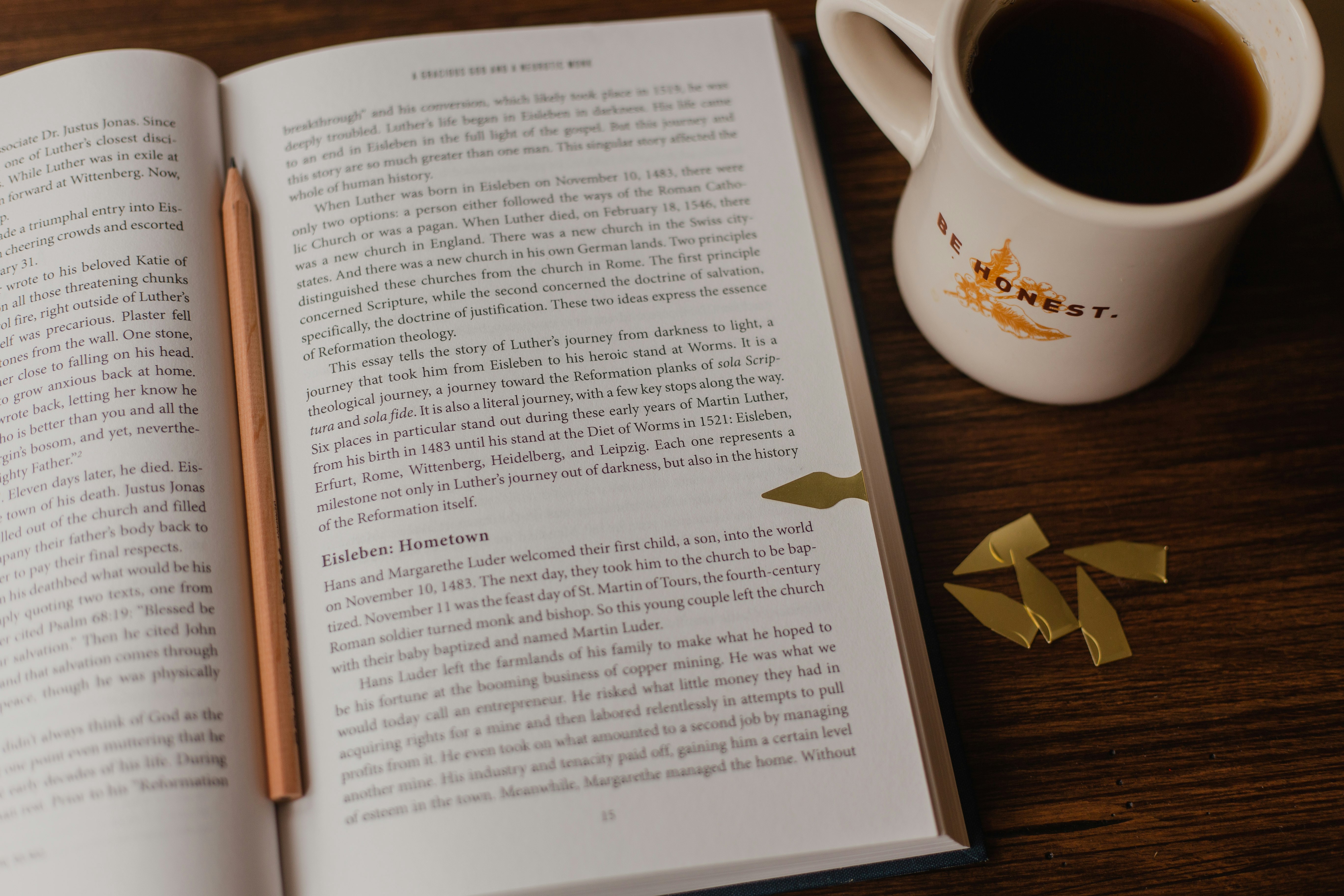 white book page on brown wooden table